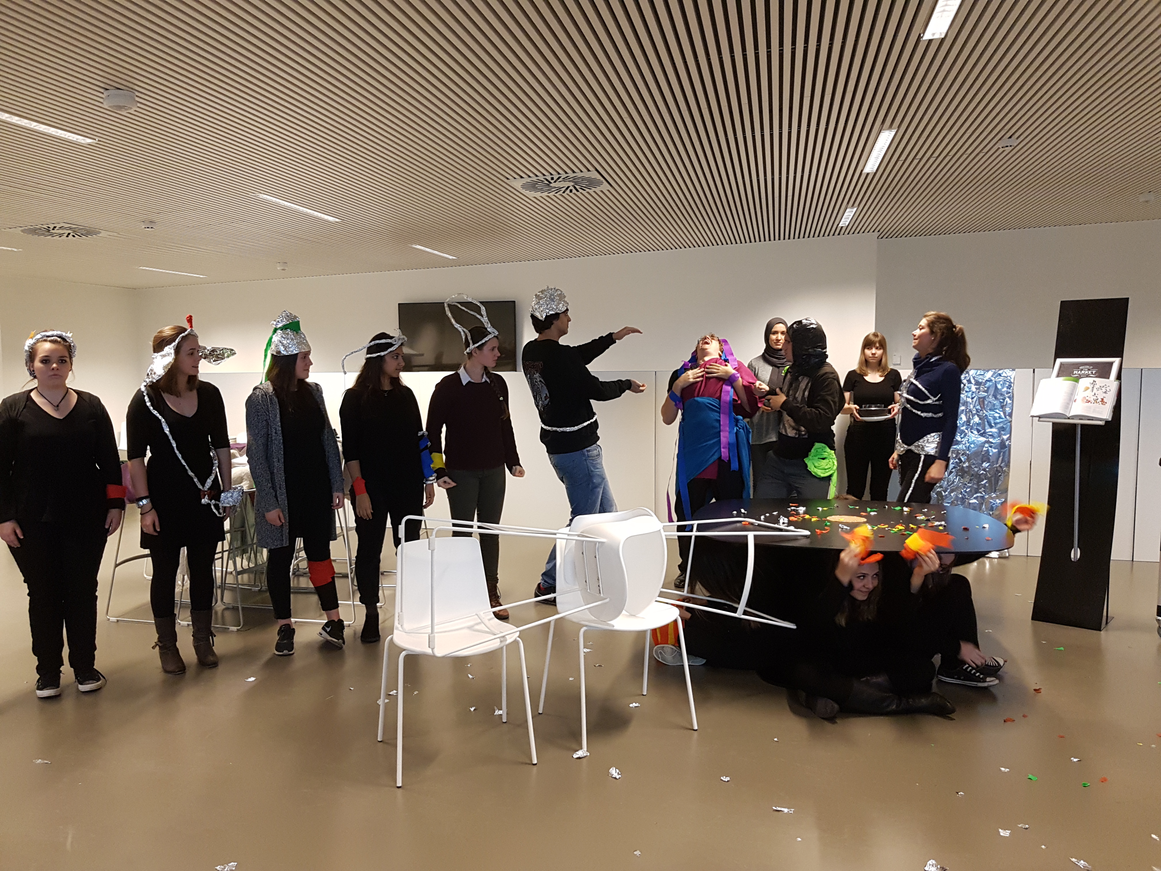 Students dressed up in Moon Village clothes perform a WASO play to make pancakes on the moon